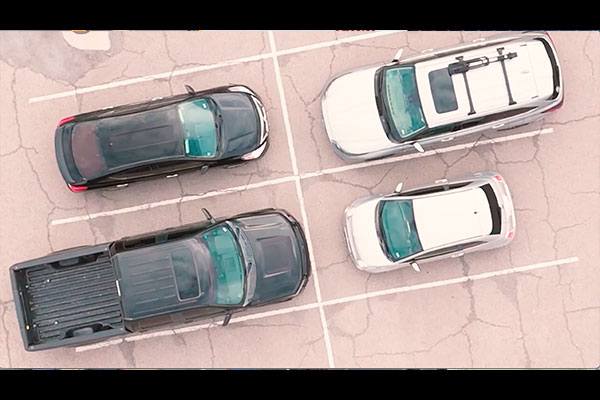 four cars in a parking lot