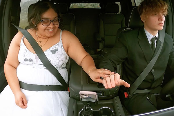 bride telling her husband its her job to text while he is driving