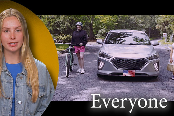 Teen with EVERYONE written on the screen with a car bike and pedestrian