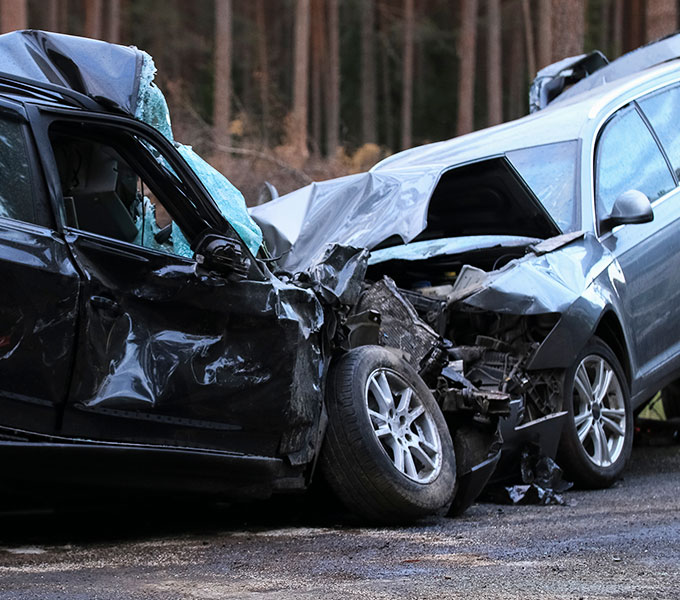 2 cars that have had a very bad crash
