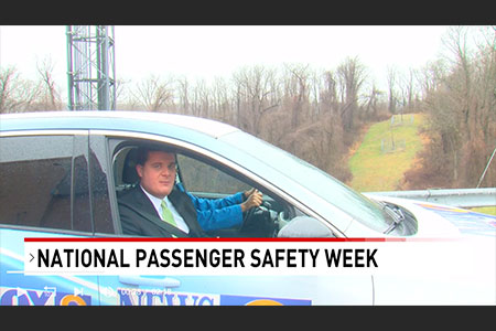 News anchor in a car talking about National Passenger Safety Week