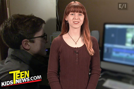 a teen girl in front of a monitor