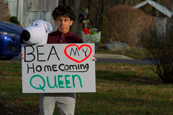Bea my homecoming queen sign with a teen boy
