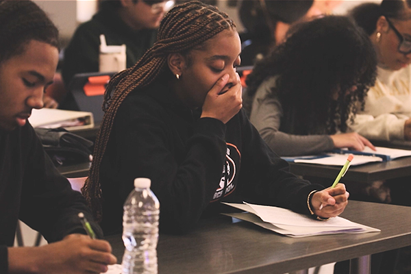 teen girl yawning in class